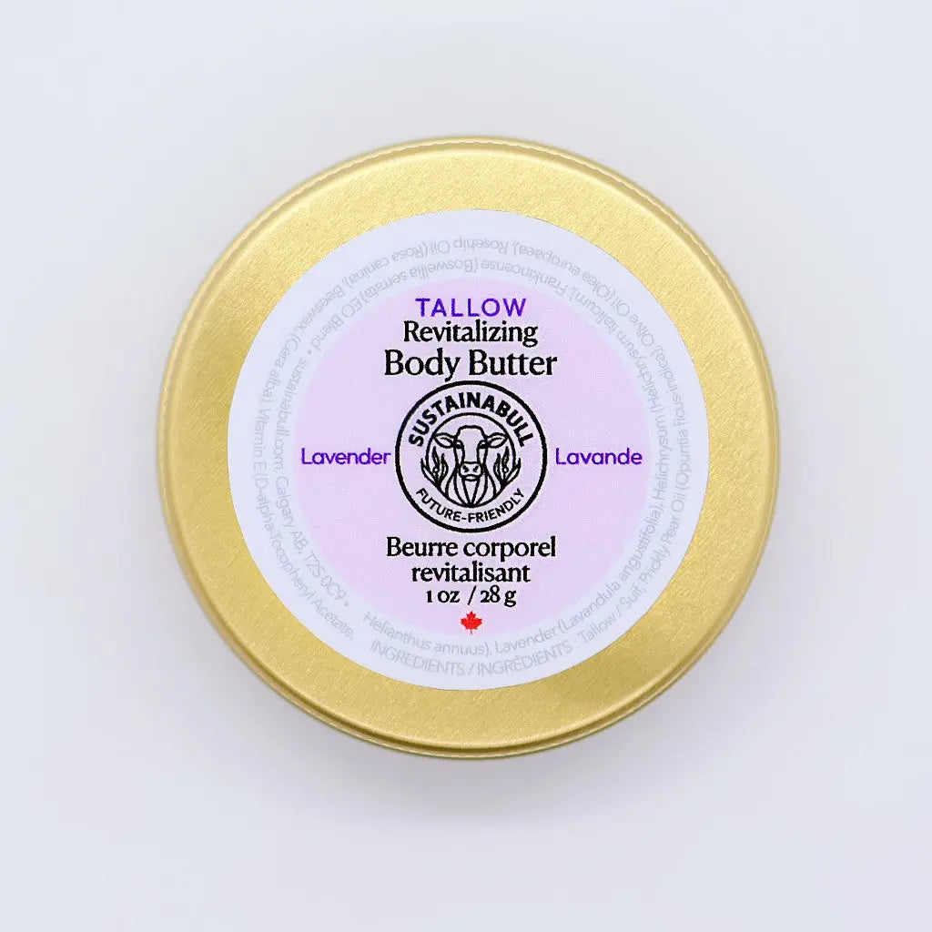 Top view of a 28g Sustainabull Lavender Revitalizing Body Butter gold tin on a white background.
